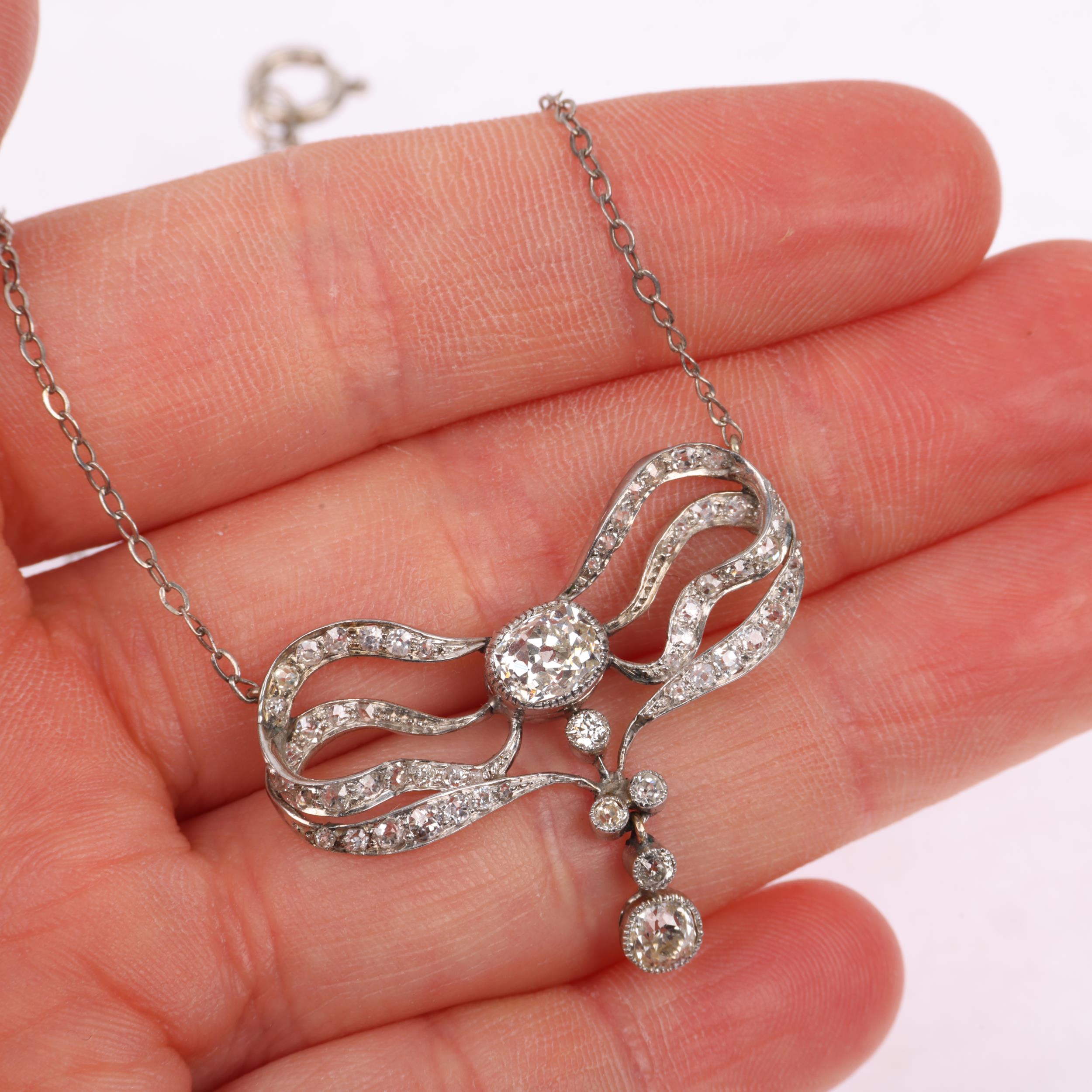 An Art Nouveau French diamond ribbon bow pendant necklace, circa 1910, set with old and eight-cut - Image 4 of 4