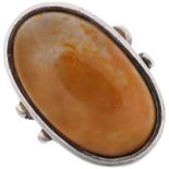 A large modernish agate dress ring, apparently unmarked white metal settings, setting height 35.3mm,