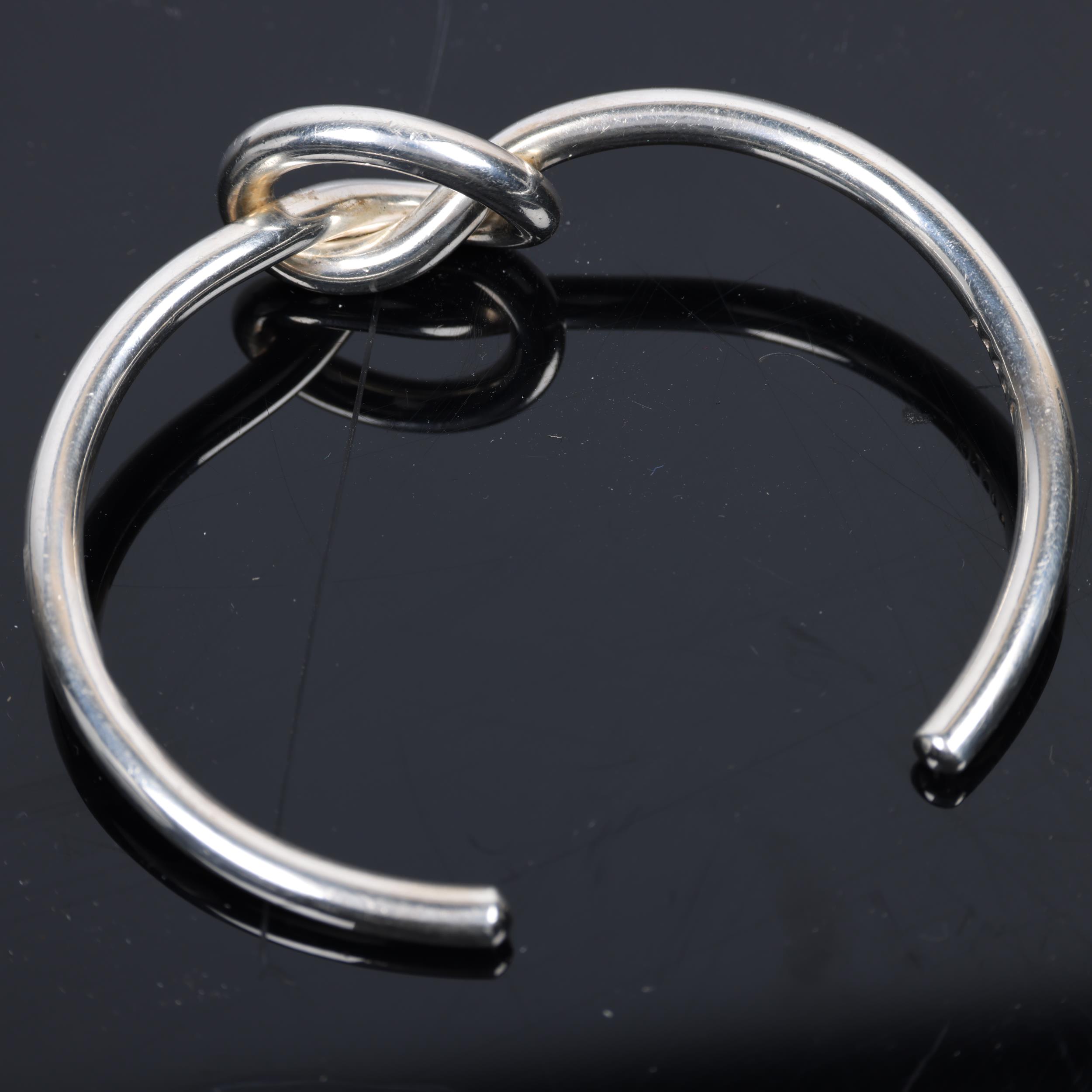 GEORG JENSEN - a Danish modernist sterling silver Love Knot cuff bangle, model no. A44B, knot height - Image 2 of 4