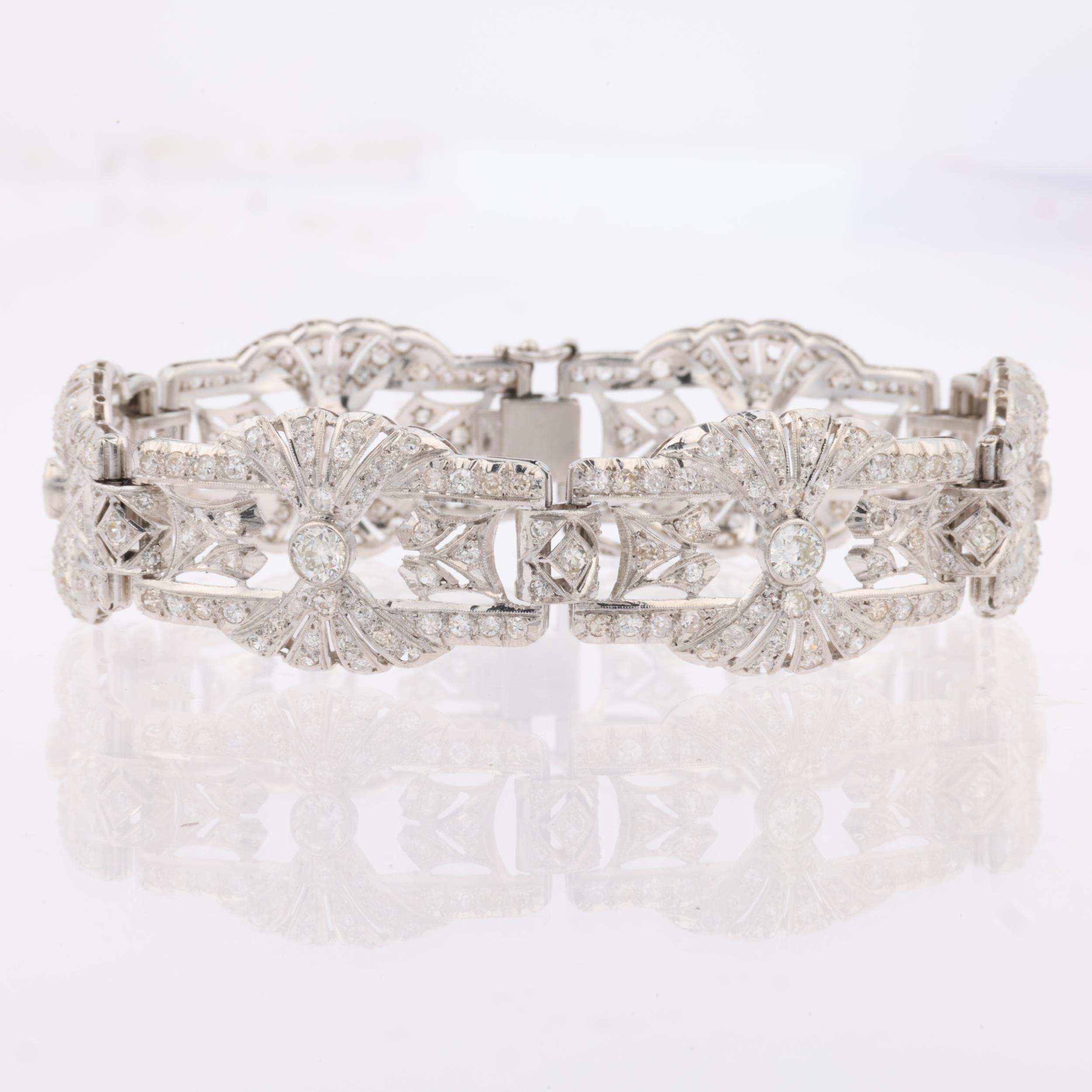 An Art Deco platinum and diamond panel bracelet, the 6 panels having openwork fan decoration and - Image 3 of 4