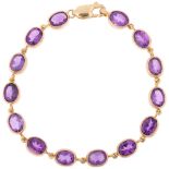 A modern 9ct gold amethyst tennis line bracelet, rub-over set with oval mixed-cut amethysts, 19cm,