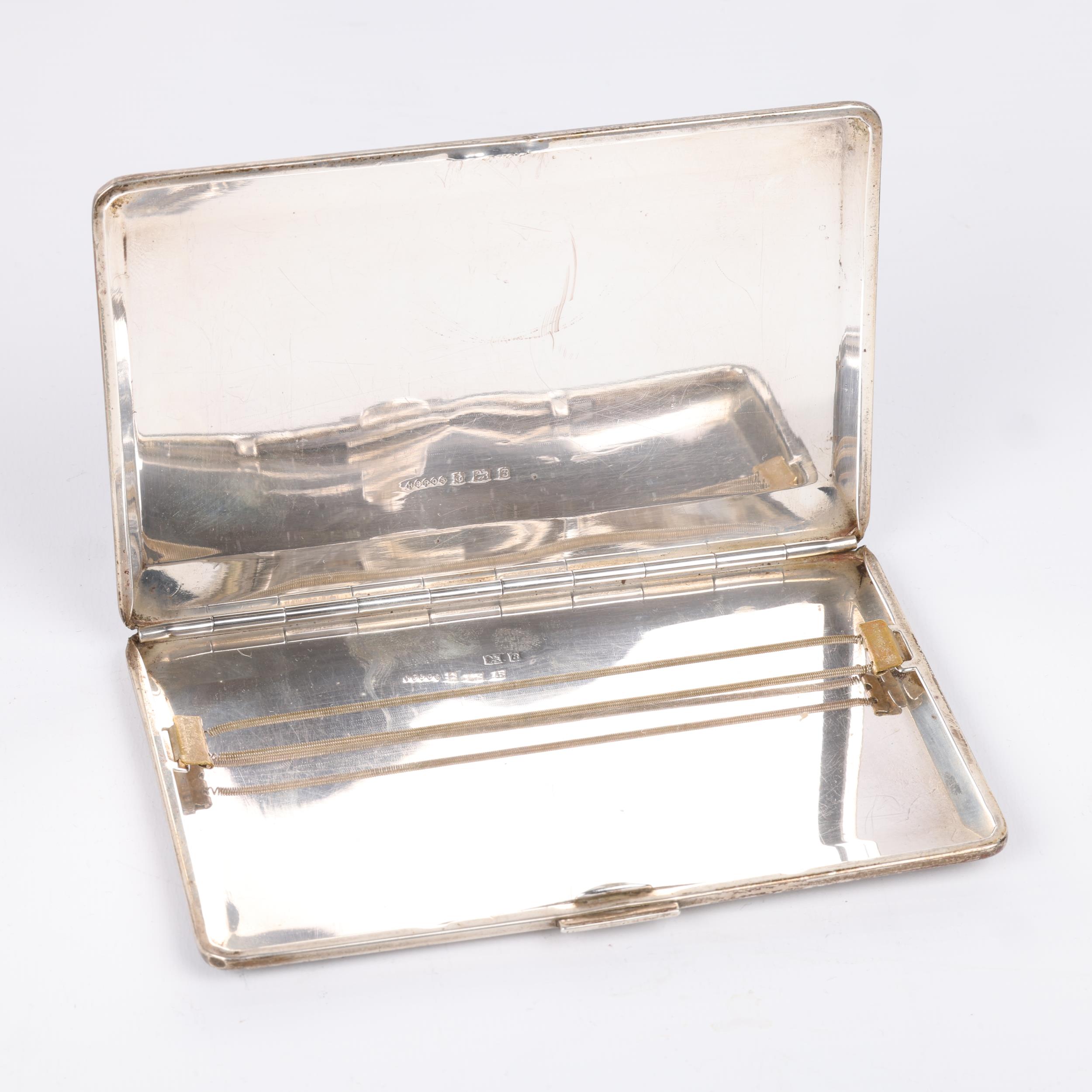 An Art Deco style George VI silver rectangular cigarette case, Harman Brothers, Birmingham 1951, - Image 3 of 3