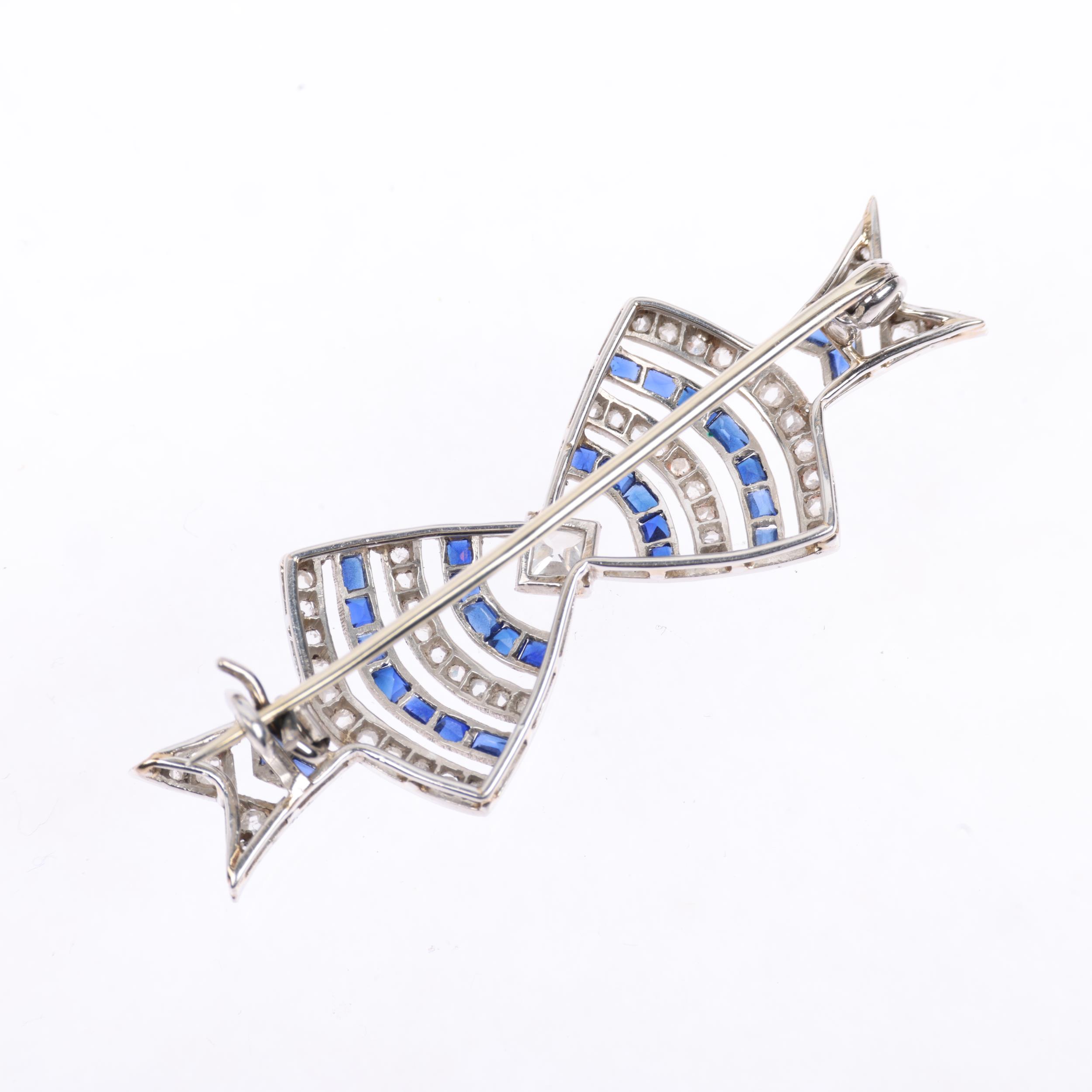 An Art Deco French sapphire and diamond openwork bow tie brooch, circa 1920, set with square and - Image 3 of 4