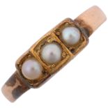 A Victorian three stone pearl mourning ring, apparently unmarked, setting height 4.9mm, size L, 2.1g