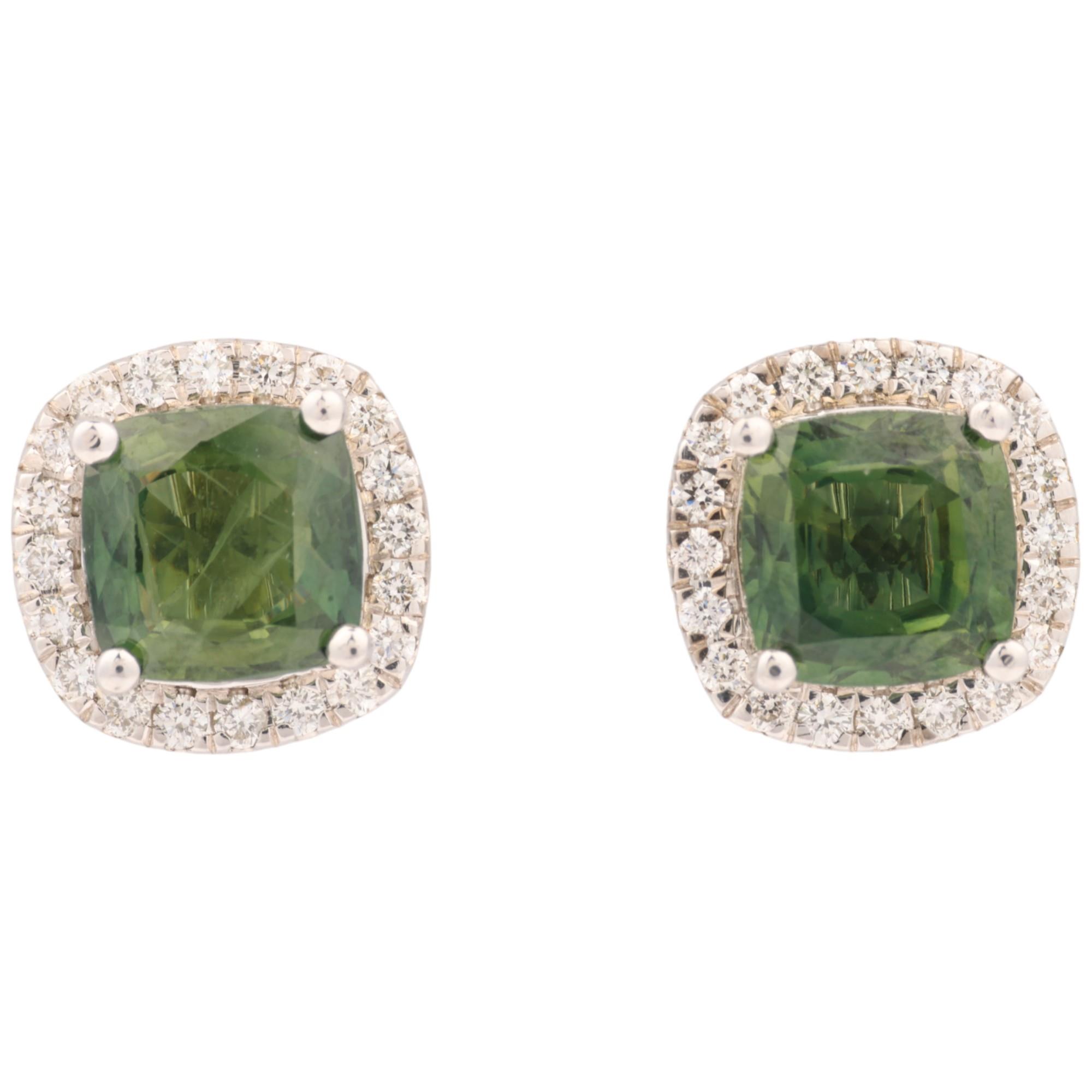 A pair of 9ct white gold demantoid garnet and diamond square cluster earrings, set with modern round
