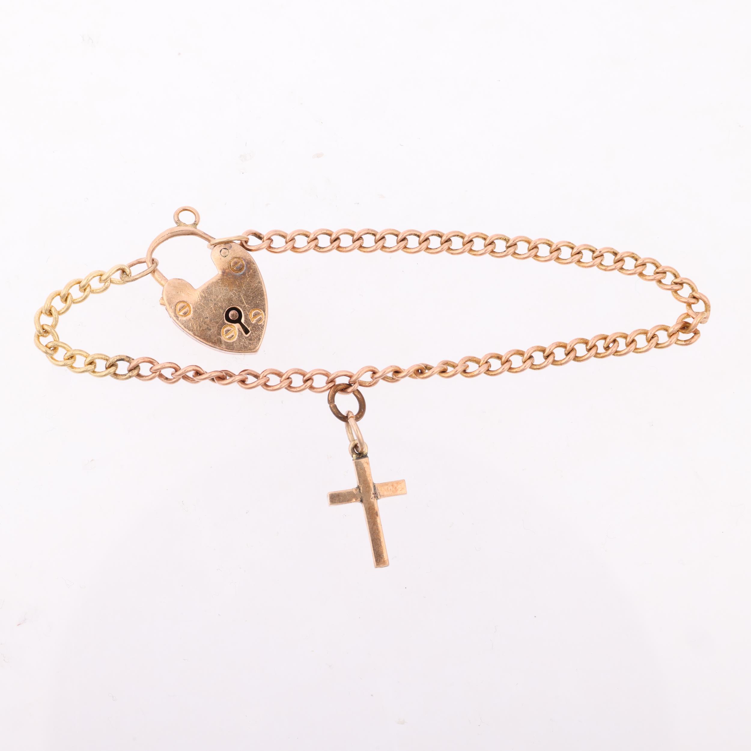 An early 20th century 9ct gold curb link chain bracelet, with unmarked gold cross charm and 9ct