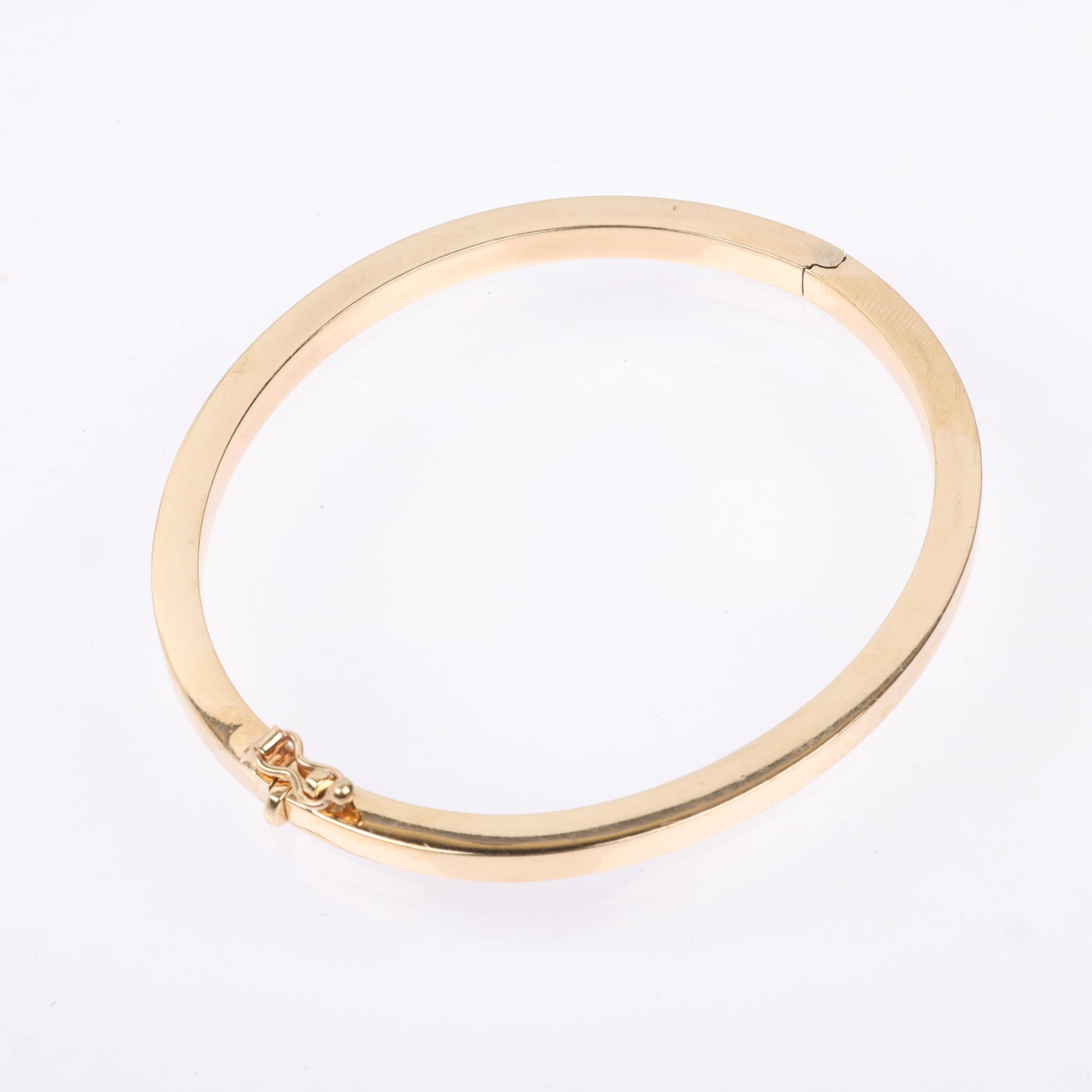 A 9ct gold plain hinged bangle, band width 4.1mm, internal circumference 18cm, 10.7g Condition - Image 2 of 4