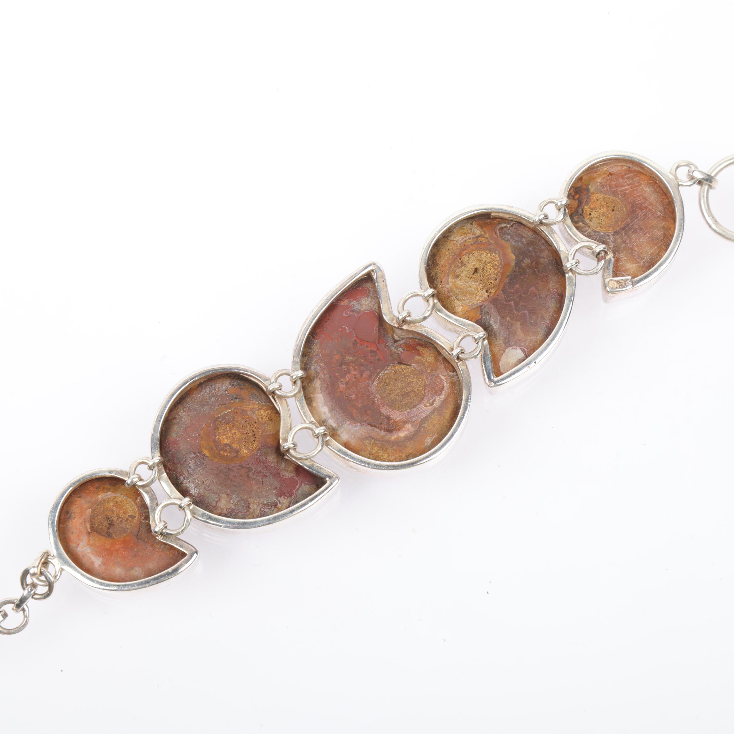 A sterling silver graduated ammonite fossil panel bracelet, 21cm, 54.6g Condition Report: No damage, - Image 3 of 3