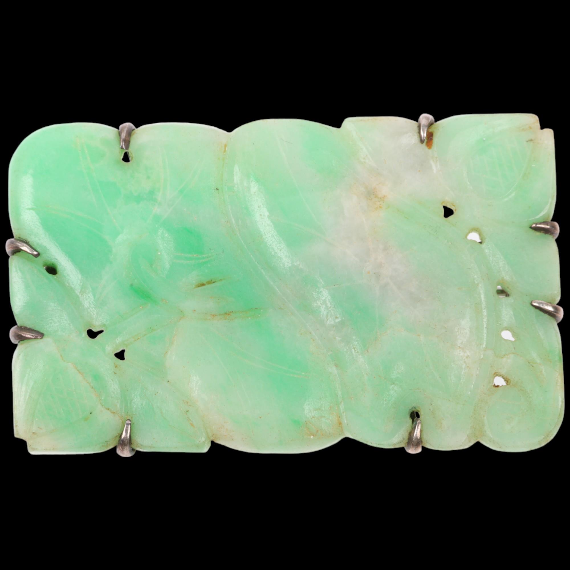 An early 20th century carved and polished jade floral panel brooch, apparently unmarked, 60.1mm,