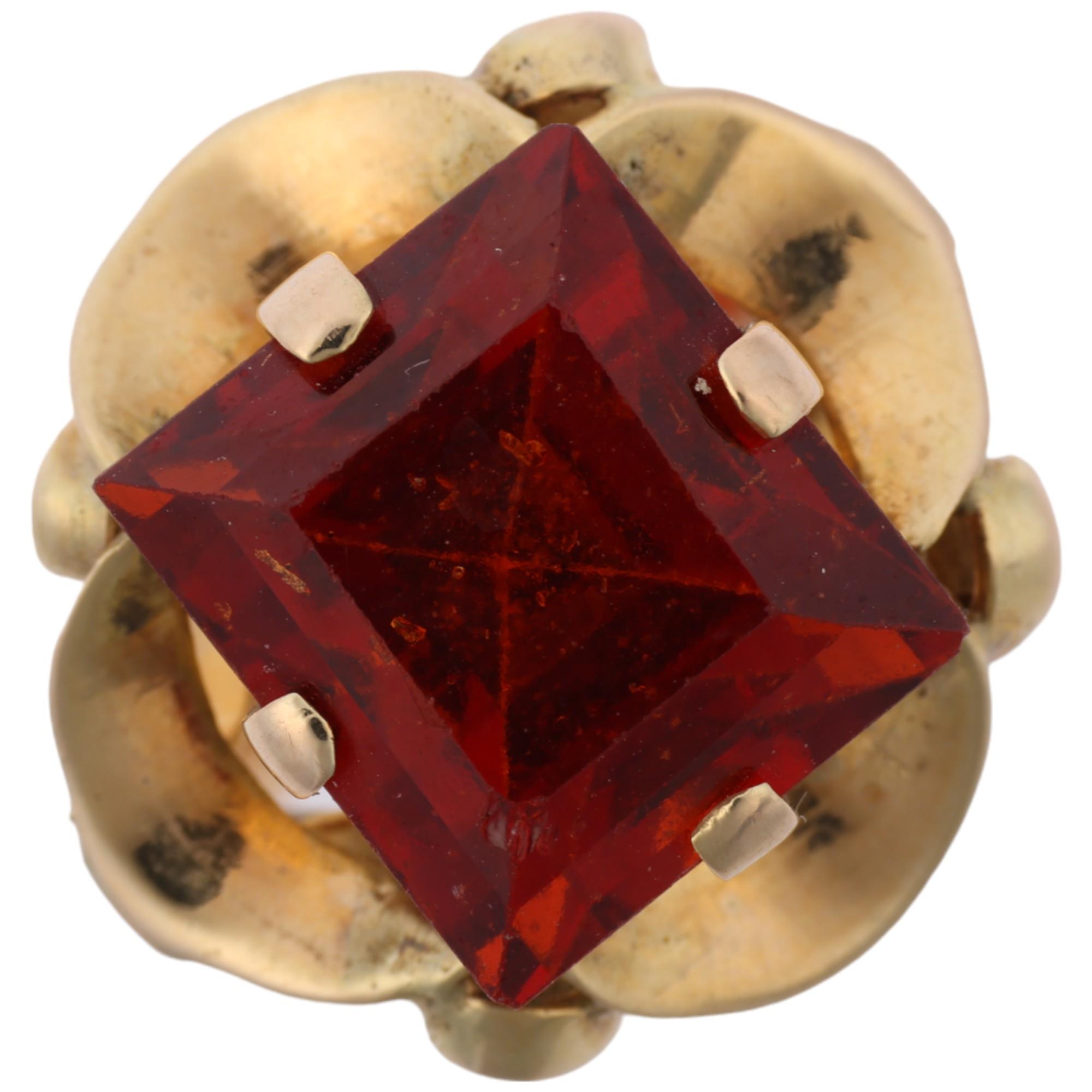 A late 20th century hessonite garnet dress ring, claw set with 9ct rectangular step-cut garnet,