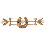 An Edwardian sapphire and pearl lucky horseshoe openwork bar brooch, circa 1910, apparently