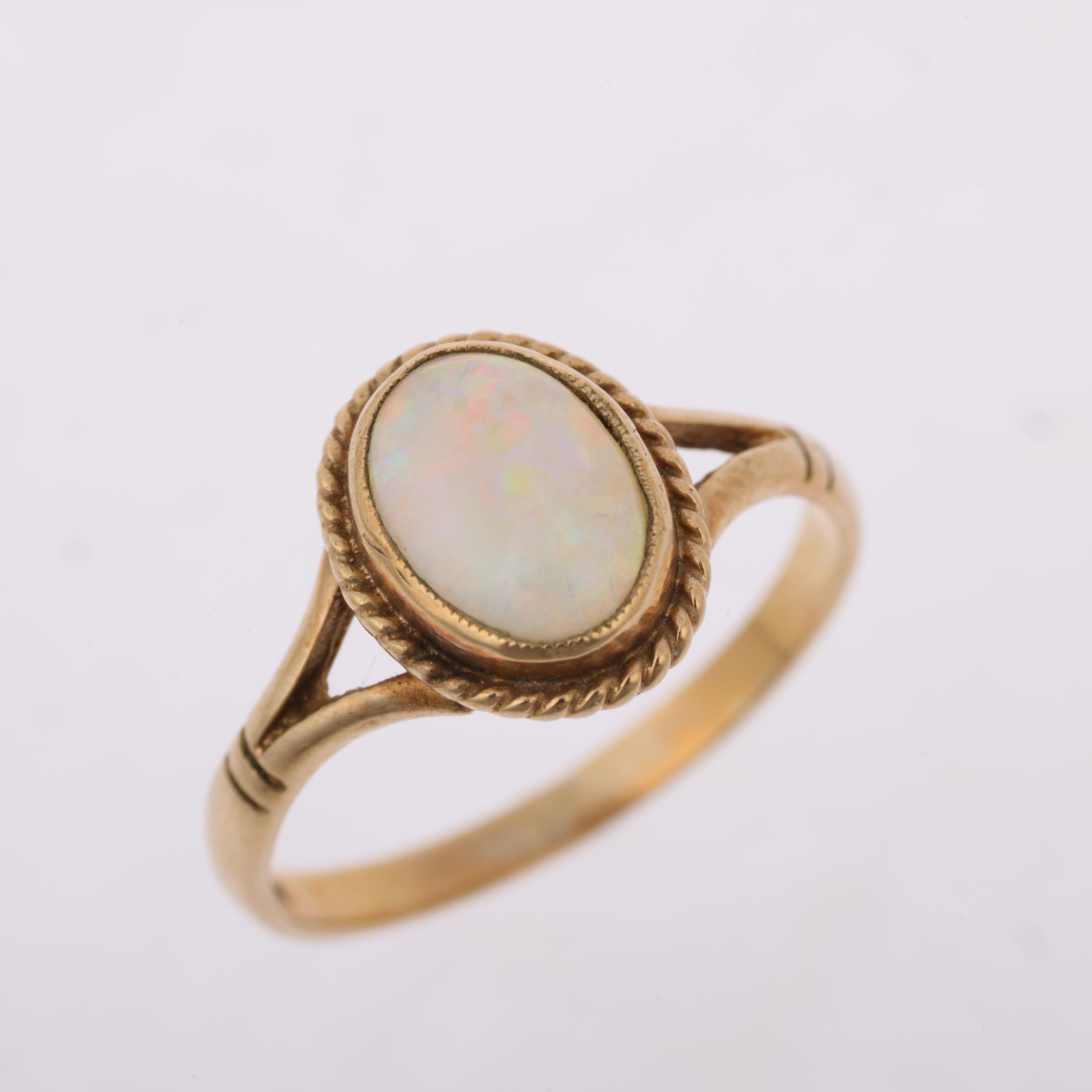 A late 20th century 9ct gold opal dress ring, maker S&S, Birmingham 1995, rub-over set with oval - Image 2 of 4
