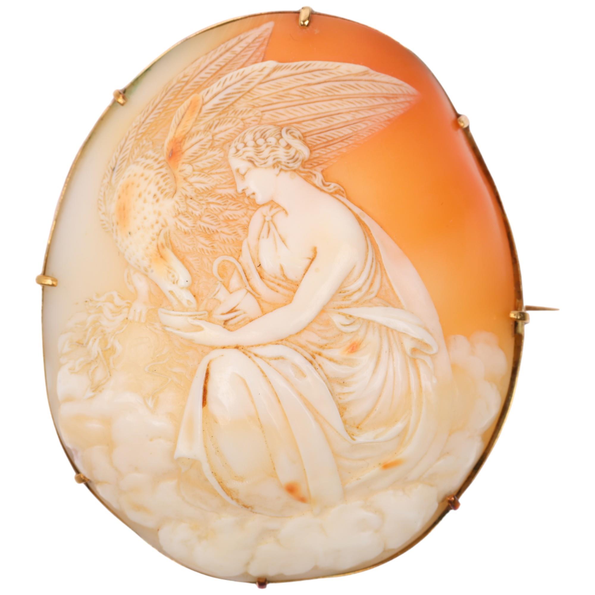 A large Victorian shell cameo brooch, relief carved depicting Hebe feeding eagle Zeus, in unmarked