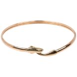 A late 20th century 9ct gold dolphin torque bangle, maker CJ Ltd, Birmingham 1993, band width 3.6mm,