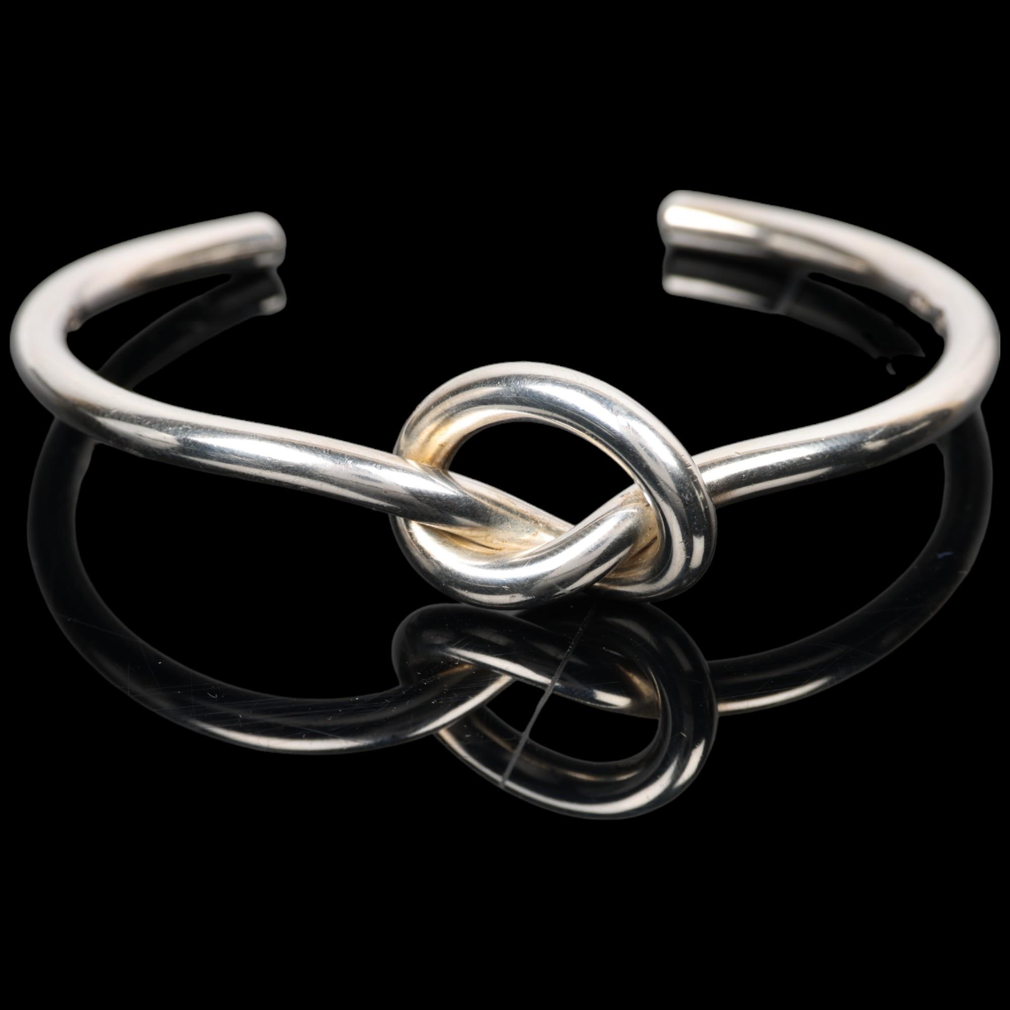 GEORG JENSEN - a Danish modernist sterling silver Love Knot cuff bangle, model no. A44B, knot height