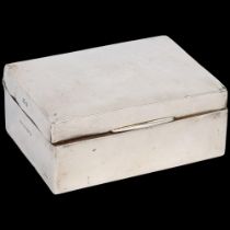 A George V silver rectangular cigarette box, Fred H Adams & Co, Birmingham 1923, 11.5cm x 8.5cm, 9.