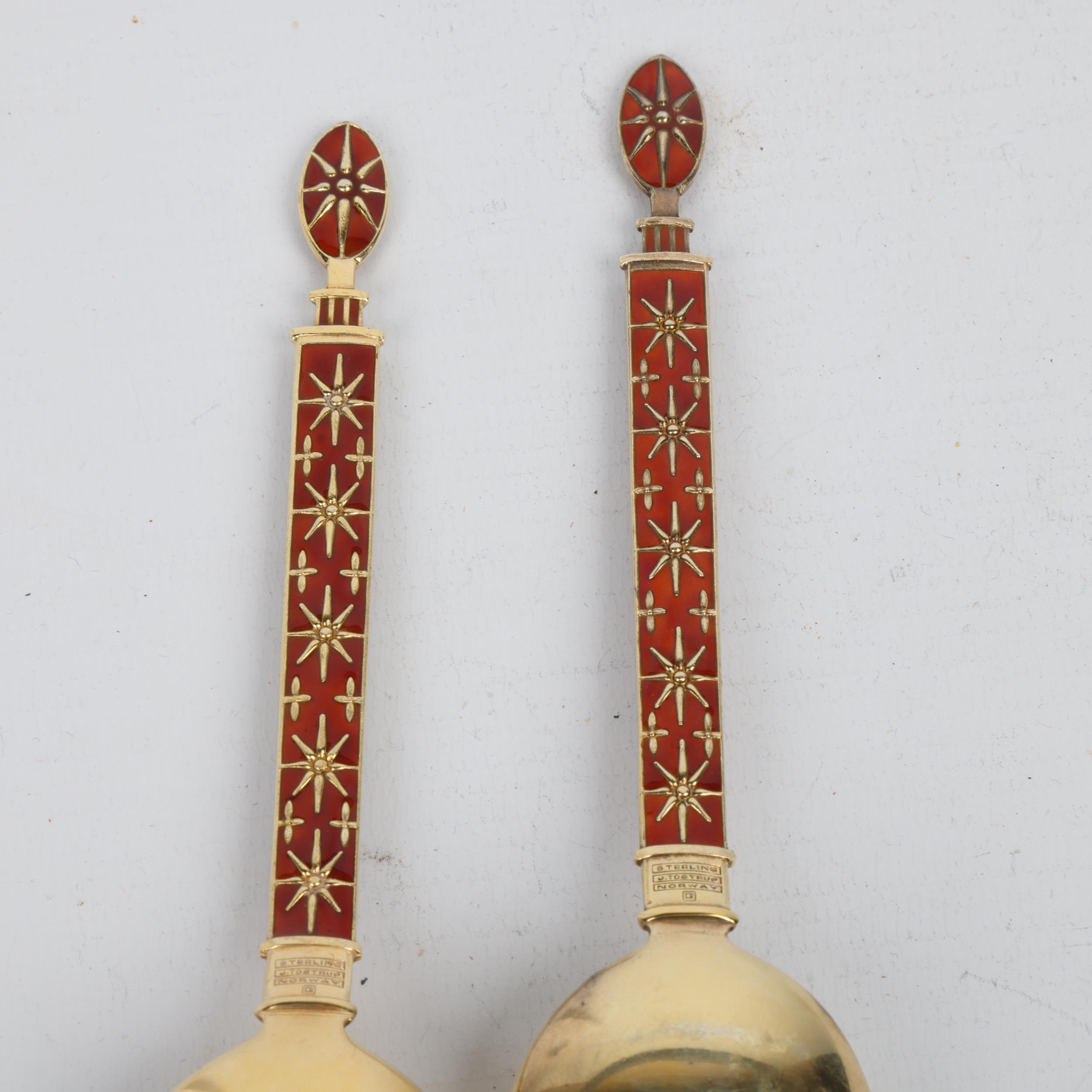 J TOSTRUP - a pair of Norwegian modernist sterling silver-gilt red enamel servers, Oslo circa - Image 3 of 3