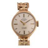 ROTARY - a lady's 9ct gold mechanical bracelet watch, silvered dial with applied gilt baton hour