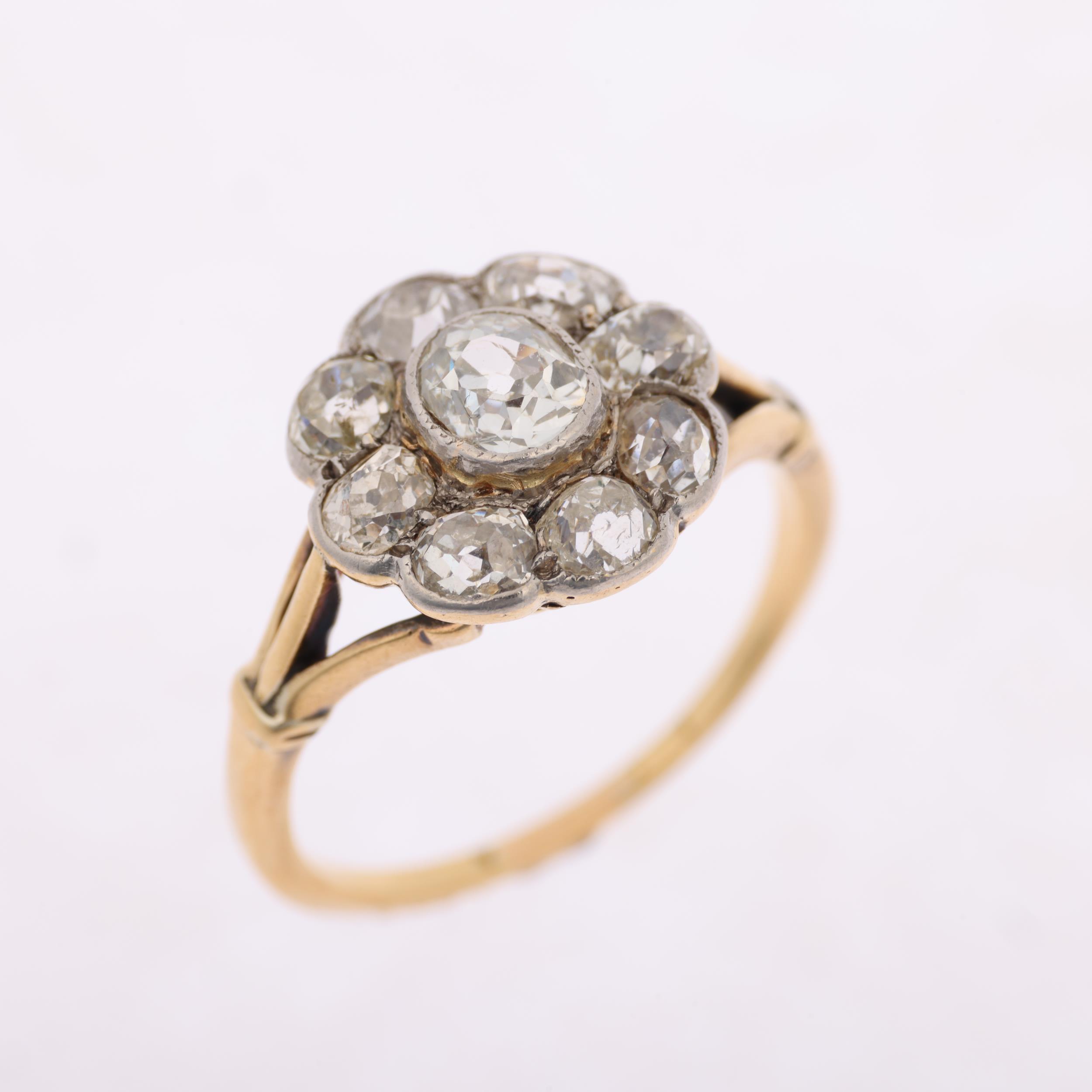 An 18ct gold diamond flowerhead cluster ring, rub-over set with old-cut diamonds, total diamond - Image 2 of 4