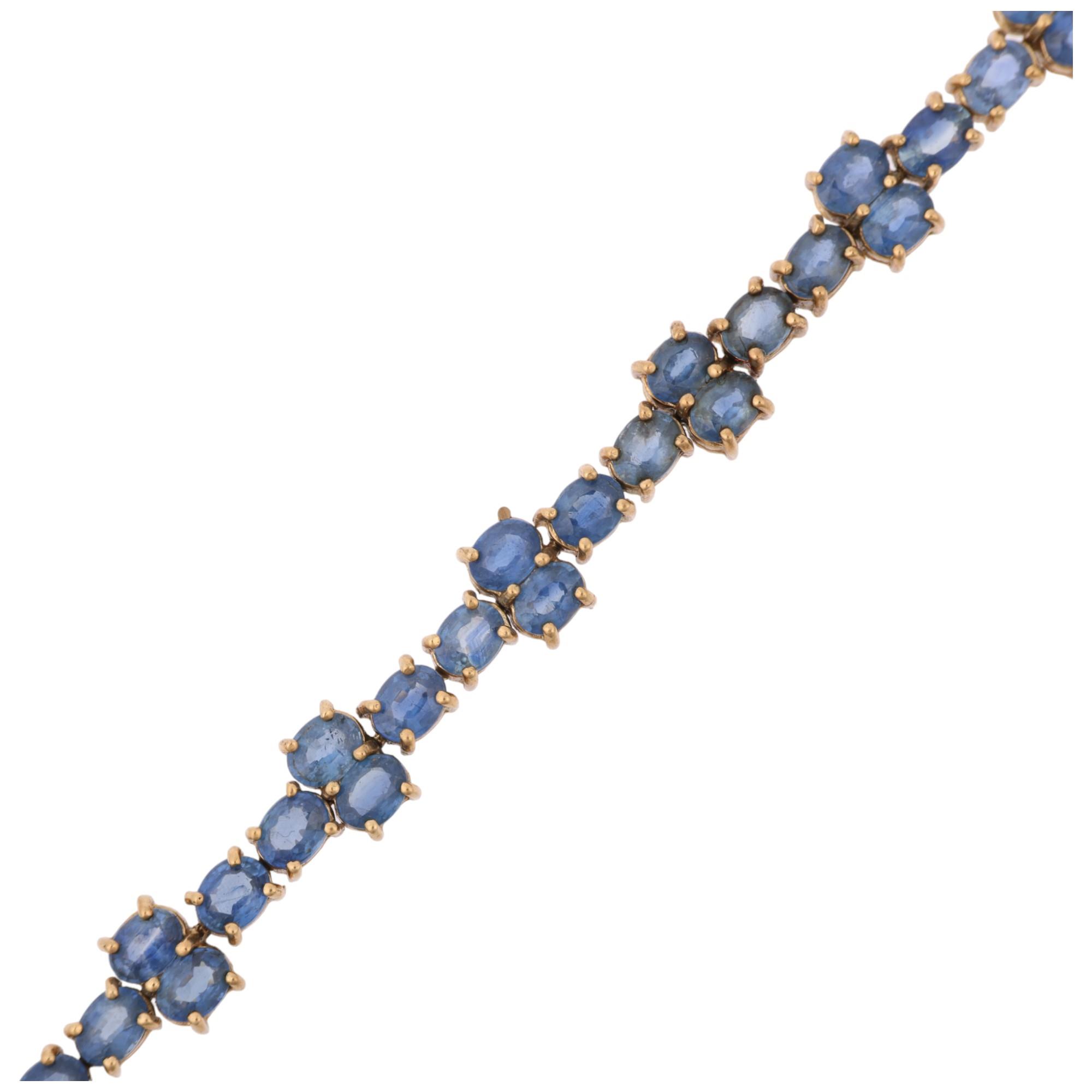 A modern 9ct gold sapphire tennis line bracelet, Birmingham 2005, set with oval mixed-cut sapphires,