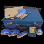 An Art Deco George V blue leather travelling vanity case, containing the original silver and blue