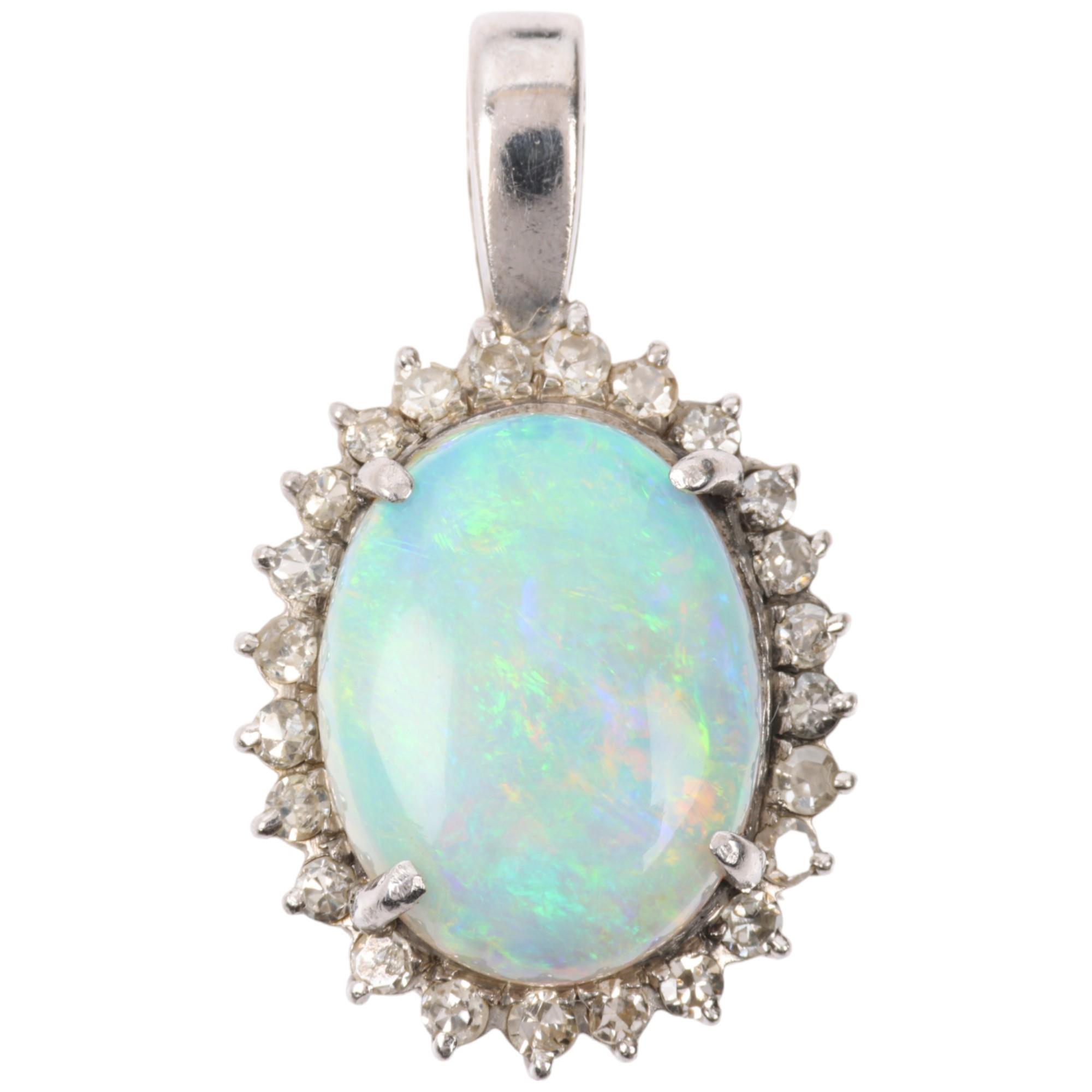 A late 20th century opal and diamond oval cluster pendant, claw set with 3ct oval cabochon opal