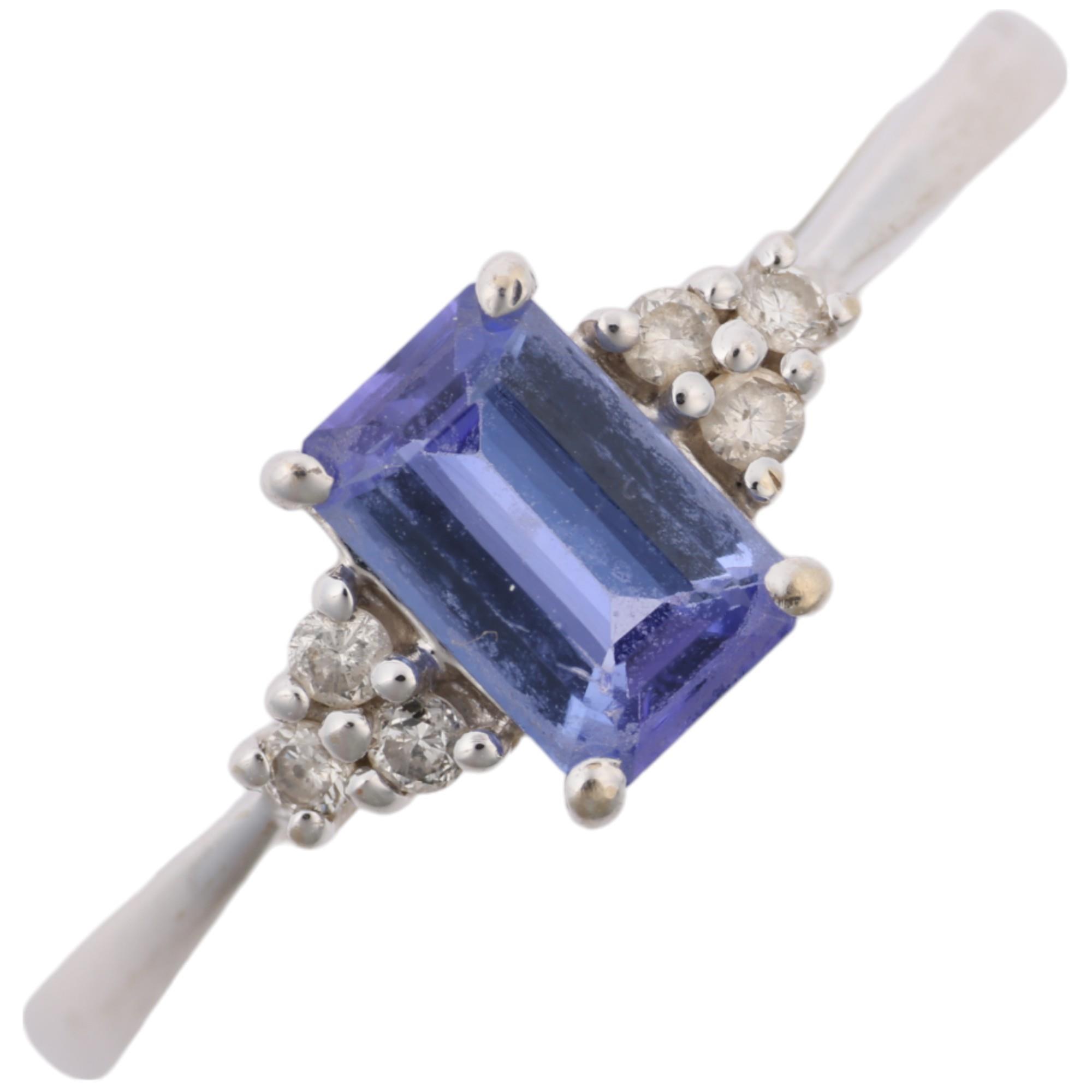 A modern 18ct white gold tanzanite and diamond dress ring, setting height 6.4mm, size M, 1.6g