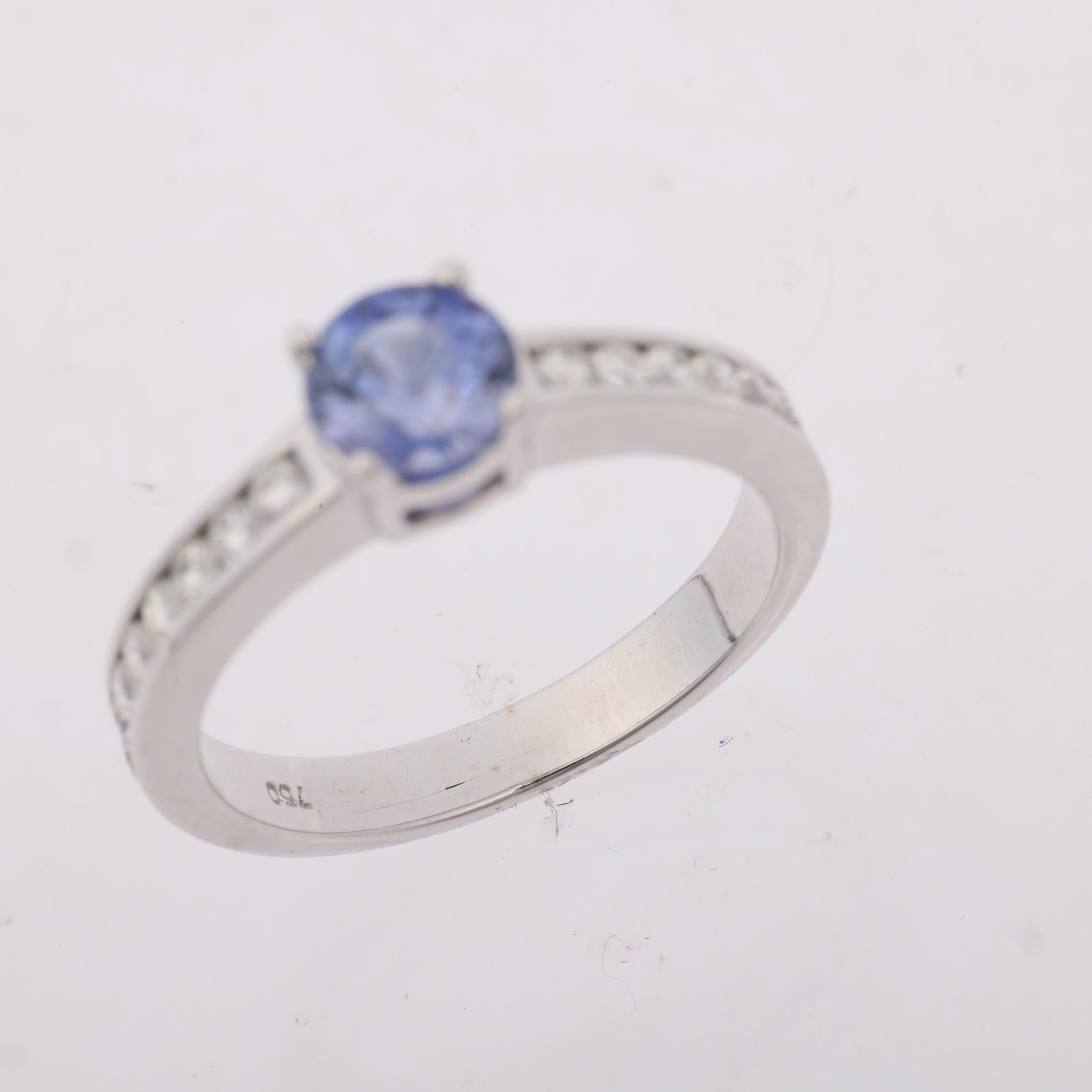 A modern 18ct white gold tanzanite and diamond ring, set with round-cut tanzanite and modern round - Image 3 of 4