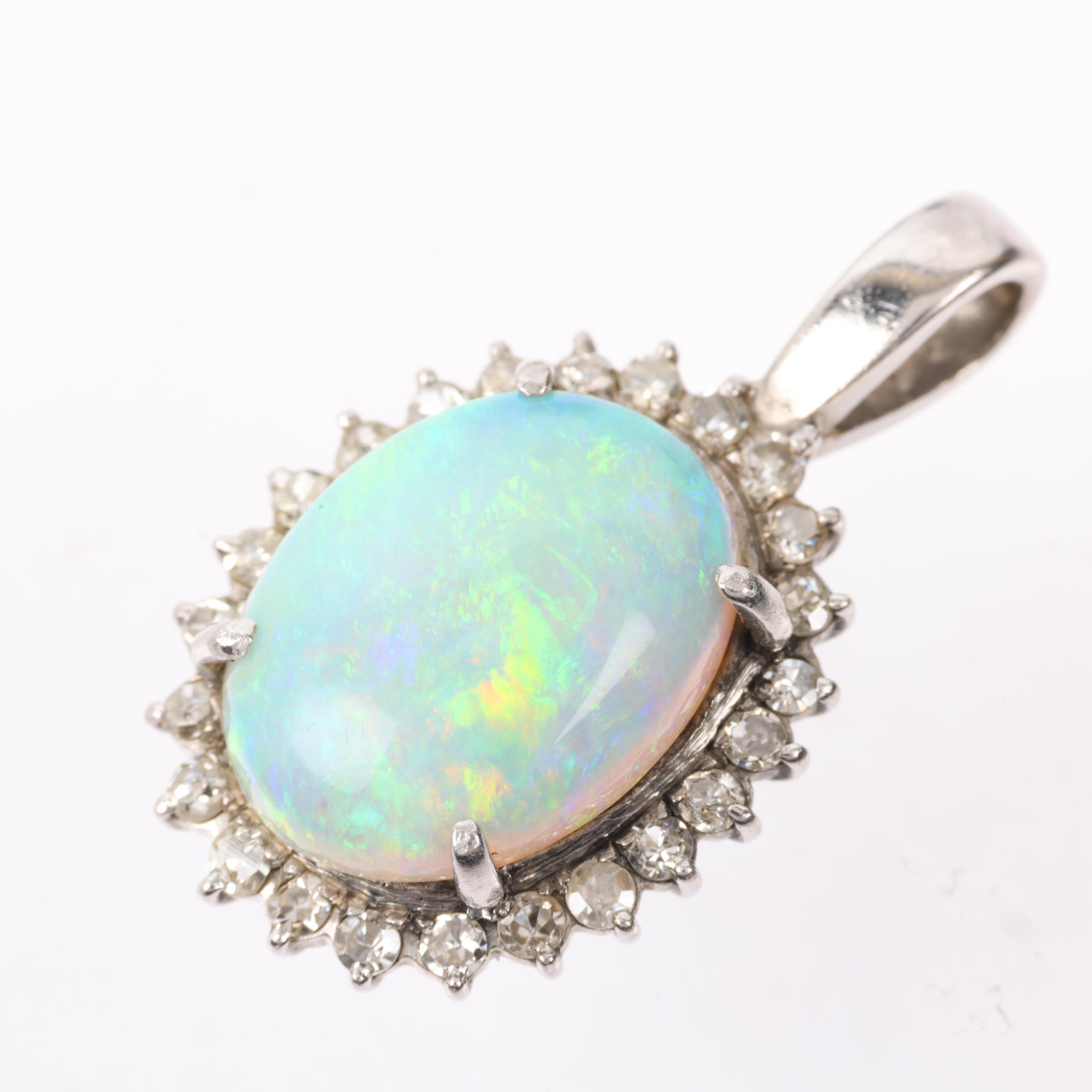 A late 20th century opal and diamond oval cluster pendant, claw set with 3ct oval cabochon opal - Image 3 of 4