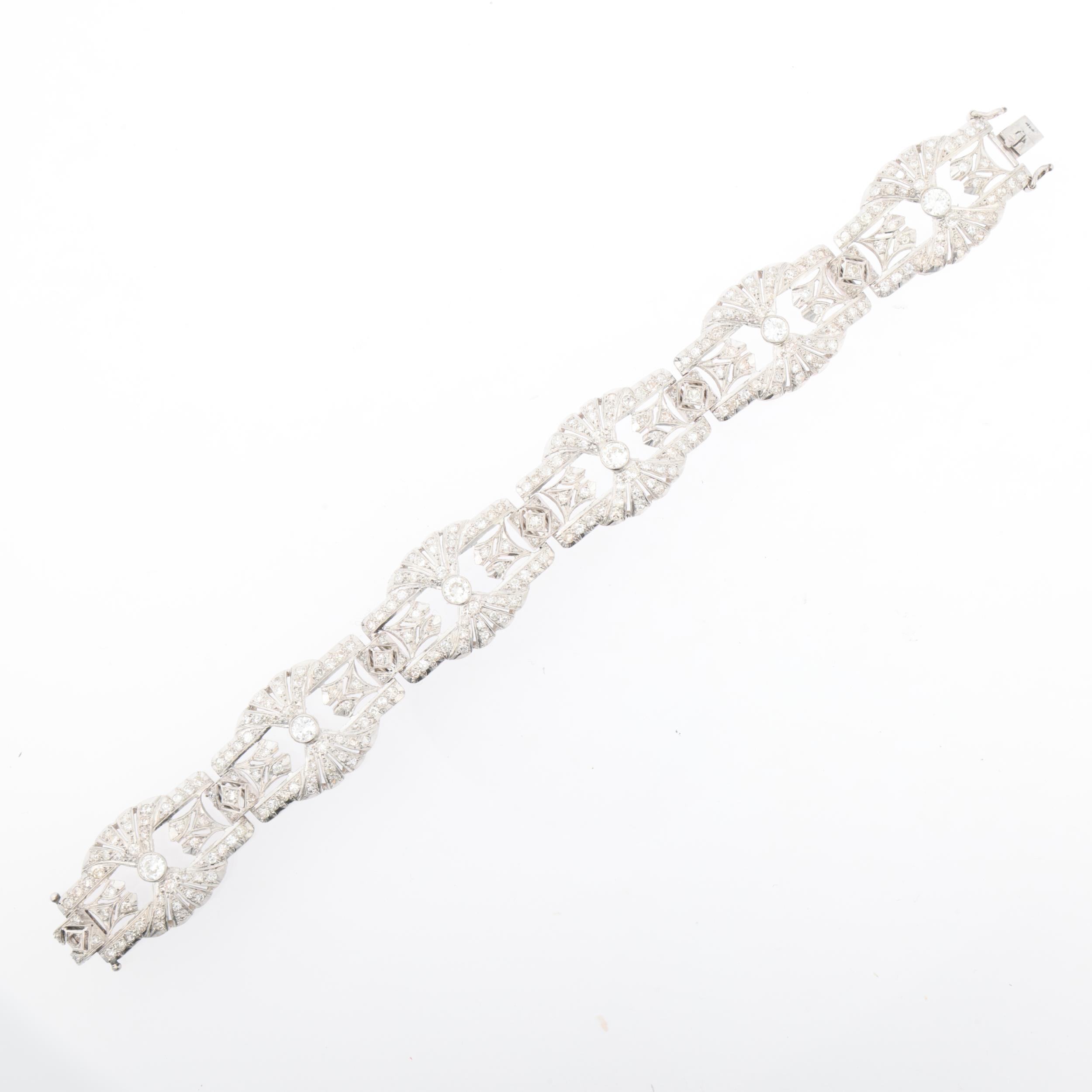 An Art Deco platinum and diamond panel bracelet, the 6 panels having openwork fan decoration and - Image 2 of 4