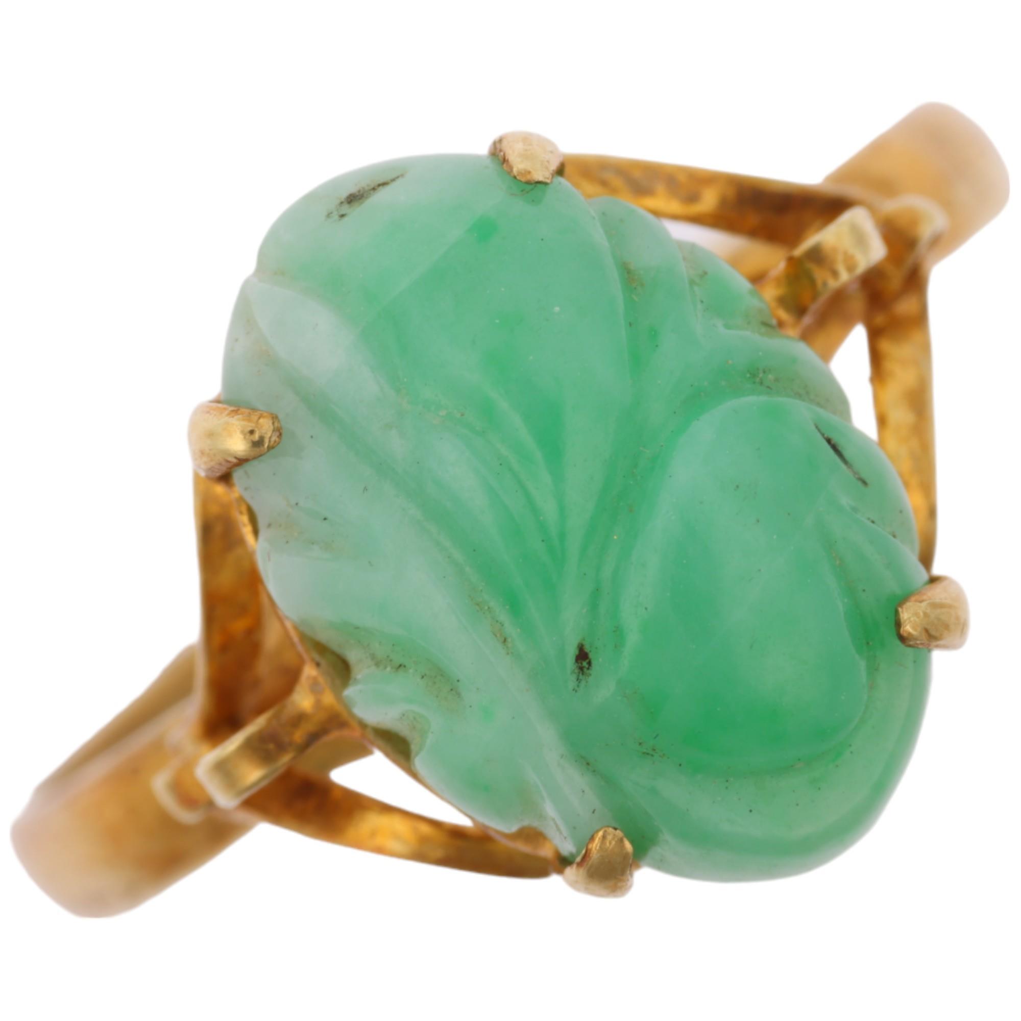 A Chinese 14ct gold carved jade panel ring, setting height 13.7mm, size T, 4.2g Condition Report: No