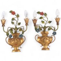 A pair of gilt-metal wall sconces, campagna urn decoration, with coloured floral gilt-metal