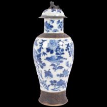 A Chinese blue and white crackle glaze jar and cover with bird and floral decoration, and dog of