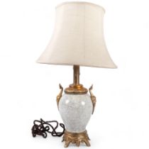A marble-effect ceramic lamp with gilt-metal mounts and shade, some damage, H60cm
