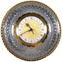 A moulded glass and gilt battery wall clock, 30cm across
