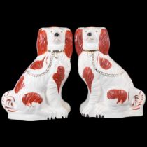 A pair of large Beswick Staffordshire Spaniels, auburn markings, both marked to the underside,