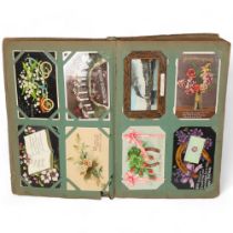 A fully stocked Vintage postcard album, containing a variety of postcards, including greetings