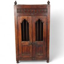 An Indian teak table-top/hanging cabinet with 2 panelled doors, 35cm x 64cm x 22cm