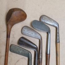 6 Vintage golf clubs