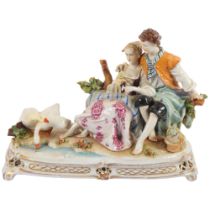 A Naples figure group, depicting a couple sitting on a bench next to some swans, L28cm