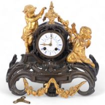 A Victorian Rococo style bronzed and gilt-metal mantel clock, with enamel dial, decorative cherub