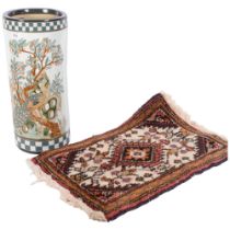 An Oriental stick stand with enamelled bird and blossom decoration, H45cm, and a small woollen rug