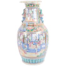 A large Chinese famille rose vase, with applied dragon dog of fo decoration, 42.5cm There is a