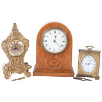 An Edwardian oak 8-day mantel clock, a Swiza 8-day clock, and a gilt-metal mantel clock with