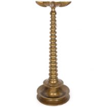 An Antique Indian bronze temple incense burner, on a ribbed turned central column and lotus stand,