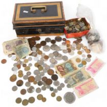 A cash tin containing various foreign coins, and banknotes, and British pre-decimal coinage