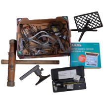 Various tools and drawing instruments, a trivet, AA badge