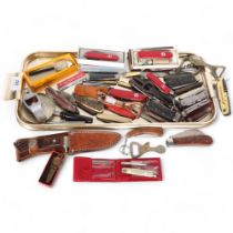 A large collection of mixed Vintage and other penknives, bowie type knife, corkscrews, etc