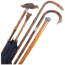 A group of various canes and walking sticks, including parasol with a carved French Bulldog head and