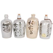 4 Japanese stoneware Sake bottles with inscriptions, tallest 26cm